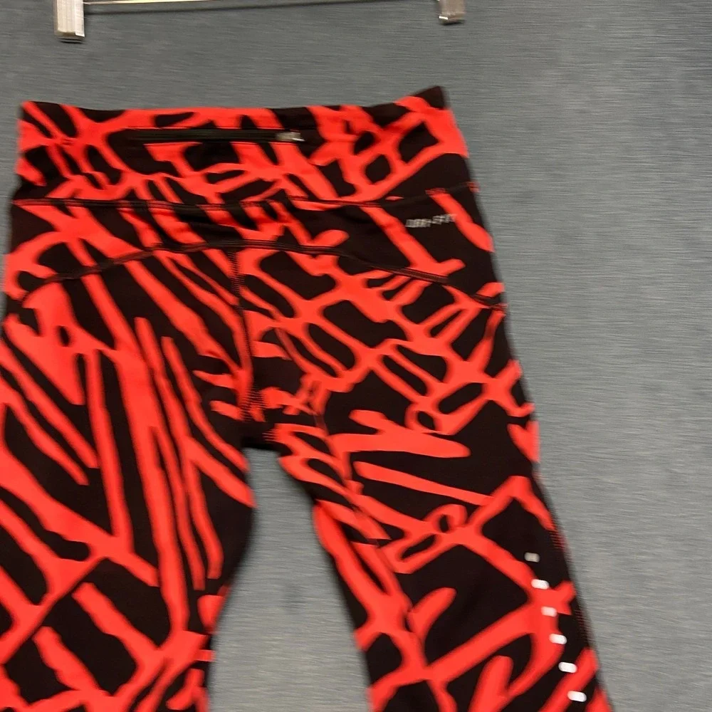 Nike Dri Fit Power Epic Lux Capri Leggings Womens XS Black Orange Abstract Print